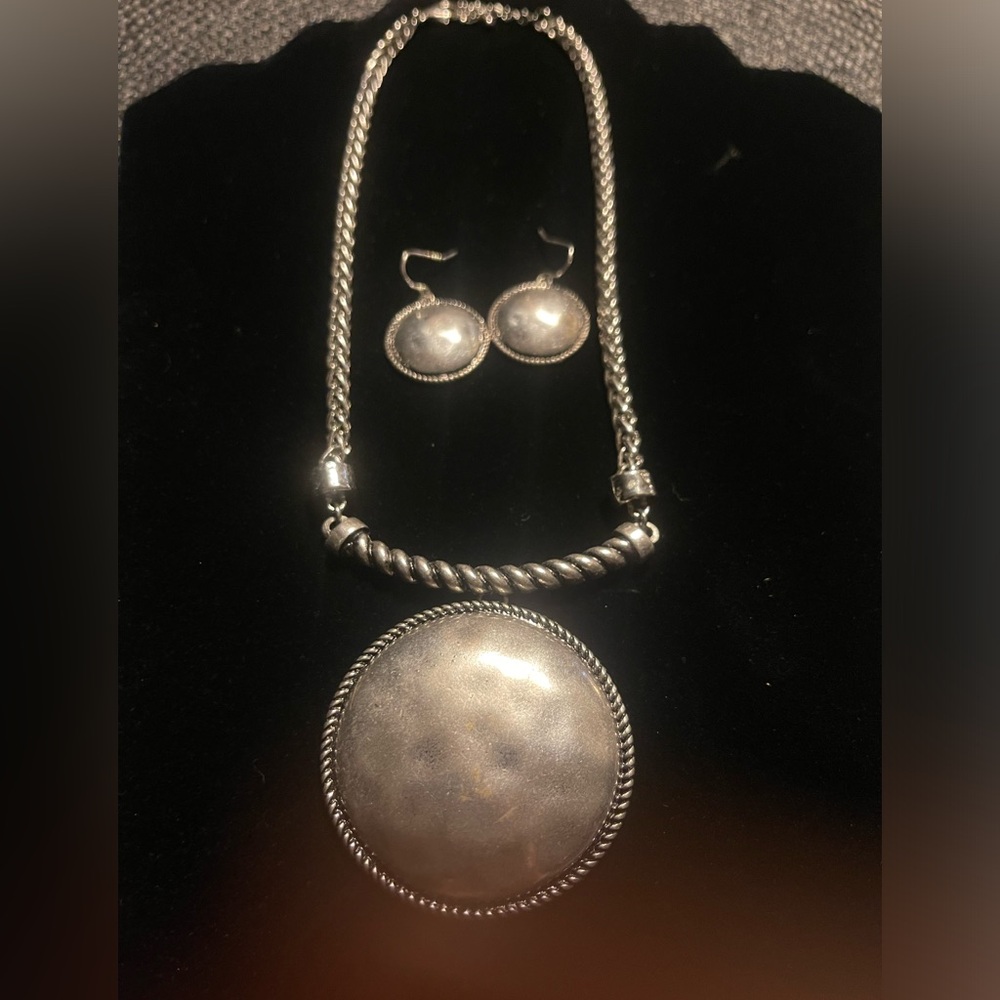 Vintage hammered silver earrings and necklace set.
